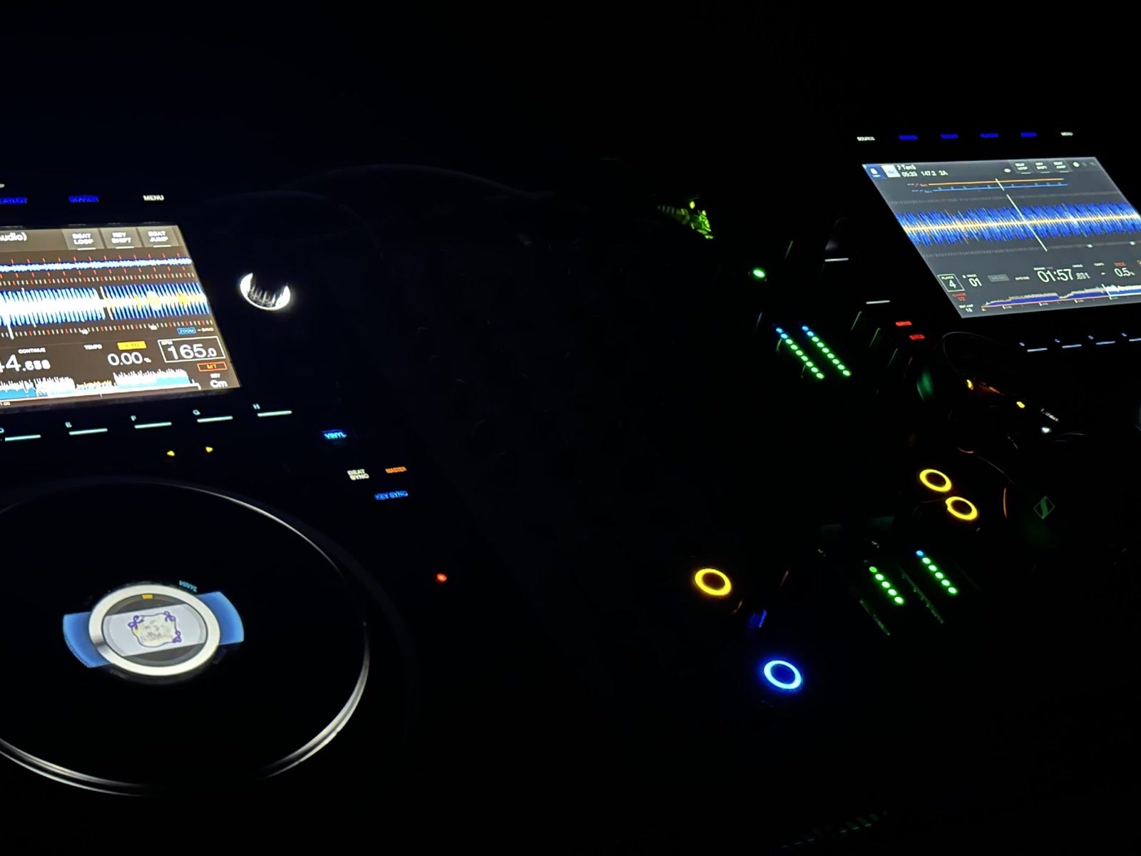 Signal Audio Hire — CDJs and a mixer lit at night